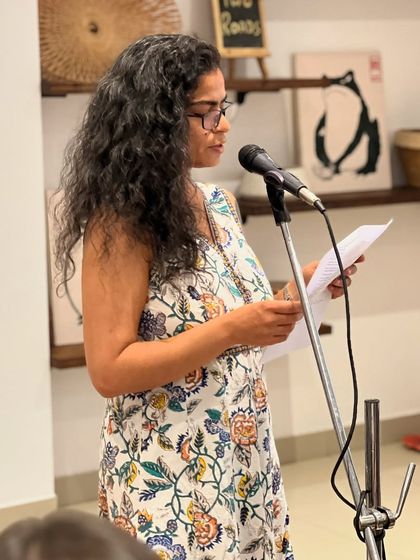 A poet delivering her piece with passion. Our open mics are filled with moments of raw emotion and powerful storytelling.