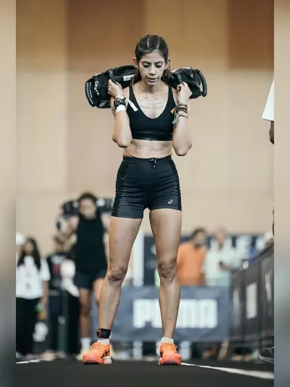 Carrying a weighted sandbag for 200 meters is a true test of core stability and endurance. This is me during a race, focused on maintaining posture and a steady pace. We'll build the strength you need to make this feel manageable.