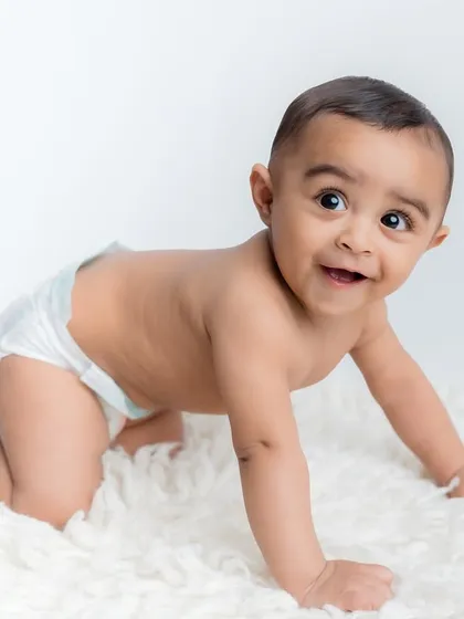 Another happy crawling photo. The simple setup keeps all the focus on the baby's adorable expression.
