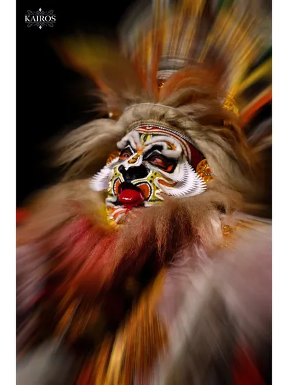 This image captures the explosive energy of a Kathakali performance. By using a zoom-burst technique, I was able to create a dynamic, abstract feel that conveys the raw power and emotion of this traditional art form.