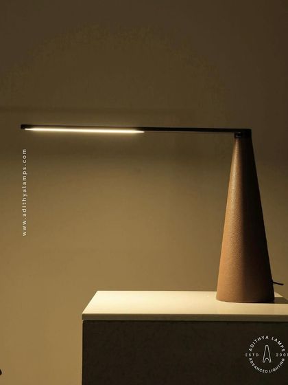 A showcase of our diverse modern table lamps. This selection includes a sleek adjustable reading lamp, a minimalist LED bar lamp, a smoked glass ambient light, and a glowing orb, demonstrating options for every style and need.