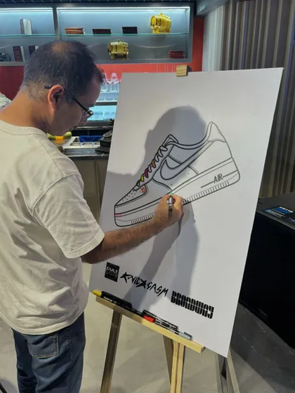 Another guest contributes to the community art piece. We provide all the markers and guidance, making it easy and fun for anyone to join in, regardless of their artistic skill.