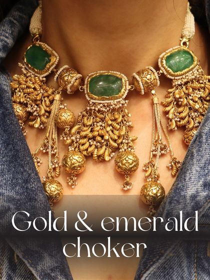 For the classic bride, I suggest our unique choker crafted in gold and emerald with intricate tassels and beadwork.