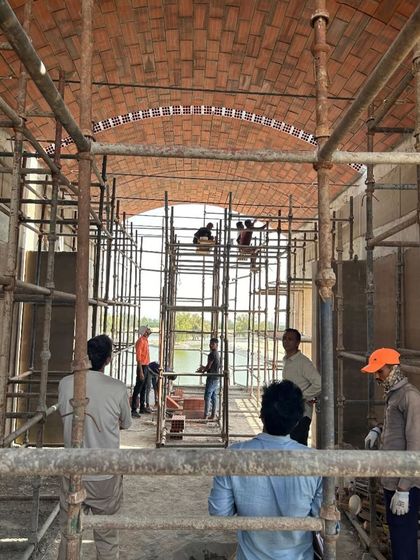 The intricate process of constructing a brick vault on site. This hands-on method is a dialogue between material, structure, and craft, where traditional building techniques are used to create innovative and timeless architectural forms.