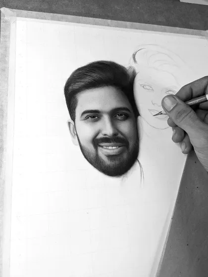 A work-in-progress shot of an A3 size couple portrait commission. Here, you can see one face is fully rendered with realistic shading and detail, while the other is just beginning to take shape from the initial outline.
