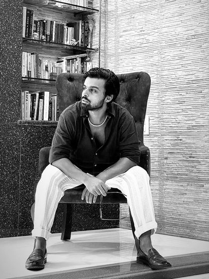 A candid, black-and-white shot. This is me, taking a moment to just be. A choreographer's life isn't always in motion; sometimes it's about quiet reflection.