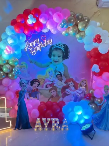 A princess-themed first birthday with a red, pink, and gold color scheme.