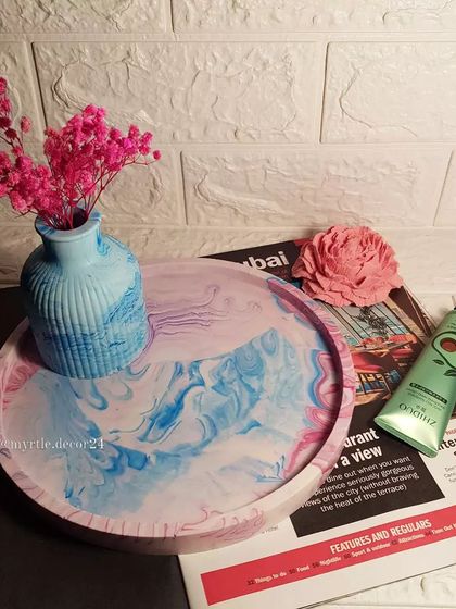 Another view of the custom marbled tray and vase set. The large surface is perfect for organizing perfumes, lotions, and other items on a vanity.