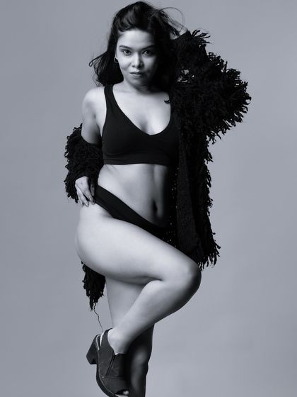 A dynamic black and white portrait with a sense of movement. The monochrome edit adds a raw, energetic vibe to the shot.