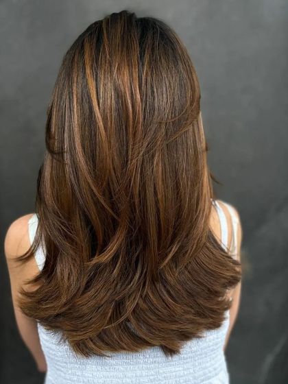 A back view of the layered cut, showing how it creates a beautiful 'V' shape.