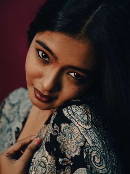 From "The Moon Opera" series, this shot has a soft, romantic feel. The lighting is gentle, and the model's expression is sweet and inviting. The paisley pattern of the dress adds a touch of bohemian elegance.