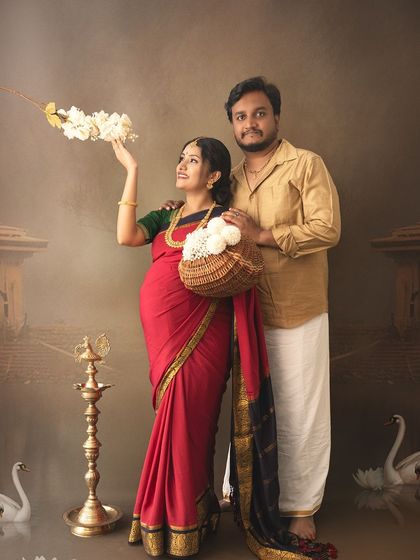 A creative and artistic couple's portrait with a traditional theme, featuring swans and temple elements for a dreamy, painterly effect.