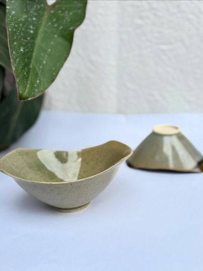 A pair of our handmade snack bowls. The altered rim gives them a modern, organic feel.