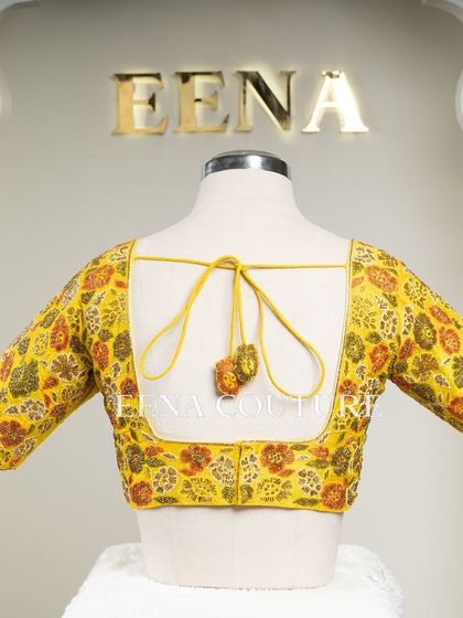 Another take on the yellow raw silk blouse, this piece features a classic Katori cut. The front is kept simple to highlight the fit, while the back and sleeves are adorned with a vibrant floral pattern in multi-colored beadwork.