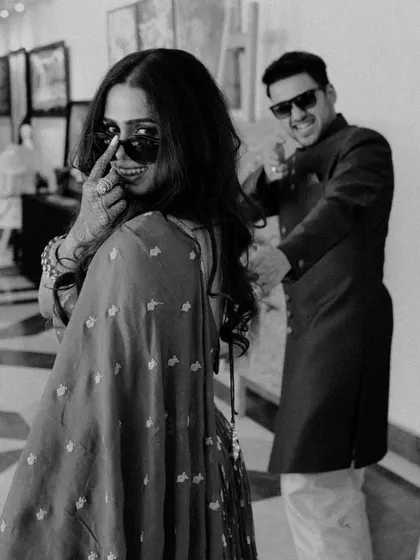 A playful, black and white candid shot that captures the fun and stylish side of a couple's personality. It’s a perfect example of how I encourage you to be yourselves and let your connection shine.