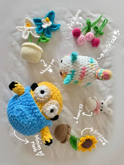 Here’s a little family photo of some of my favorite custom creations. You can see a Minion plushie, tiny potted plants that never wilt, a colorful cat, a bunny keychain, and floral charms. If you can dream it, I can probably crochet it.