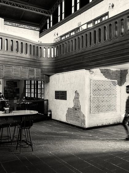 A person walking through the space, giving a sense of its scale and the open, flowing layout.