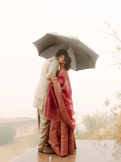 Unplanned moments are often the most precious. When the rain came, these two didn't run from it. They embraced it, and in that simple act of sharing an umbrella, they created a memory of pure, unscripted romance. I focus on capturing the heart of your story, even when nature has its own plans.