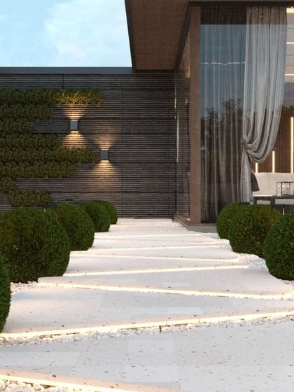 A 3D design for an upcoming project in Vikaspuri, showing a beautiful walkway with integrated lighting and manicured bushes.