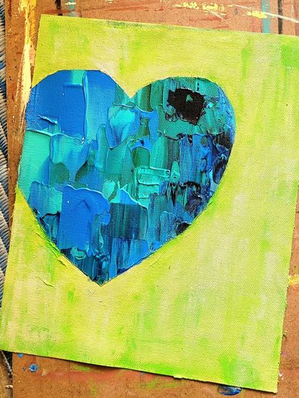 Here is the blue and green heart in its raw, unframed state, fresh from the studio. You can see the canvas texture and the thick application of paint. This is the beginning of its journey.