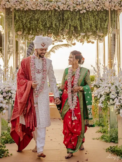 A classic walk down the aisle as a married couple, looking happy and in love.