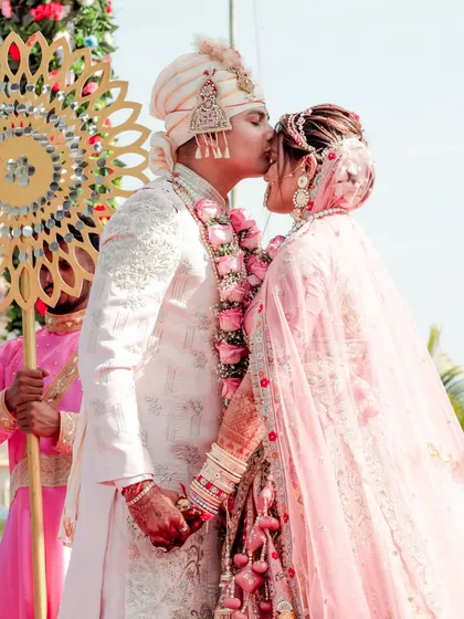 A tender moment captured right after the Varmala ceremony, showcasing the couple's joy and the beautiful start to their journey together.