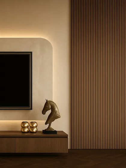 This bedroom in Uttar Pradesh is all about moody warmth. A deep red headboard is set against a stunning backlit wallpaper panel that curves around the corner of the room, creating an immersive, glowing effect.