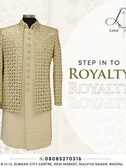 Step into royalty with this stunning jacket-style sherwani. The intricate mirror work on the jacket adds a layer of grandeur to the simple kurta underneath.