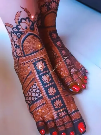 A beautiful bridal foot design with a rich, dark stain. The pattern features lotus motifs within vertical bands, creating a structured and elegant look.