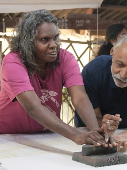 Craft transcends language. Here, an artist from the Bábbarra Women’s Centre in Australia shares a moment of learning and co-creation with one of our senior artisans. These cross-cultural exchanges are vital to keeping global craft traditions thriving.