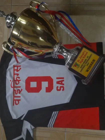 The winning combination: a Vikings jersey and a championship trophy. A common sight at our academy.