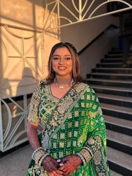 This full-length shot shows how the hairstyle complements the entire traditional outfit.