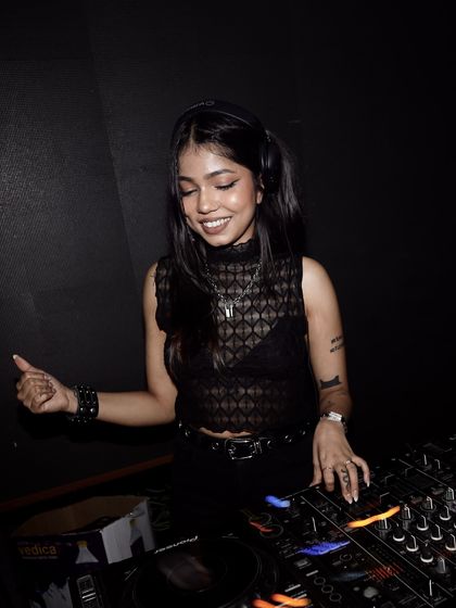 A happy moment behind the console. I love playing a mix of genres to keep the dance floor interesting.