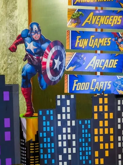 A closer look at our Captain America themed signage, complete with a cityscape backdrop that adds to the party's immersive decor.