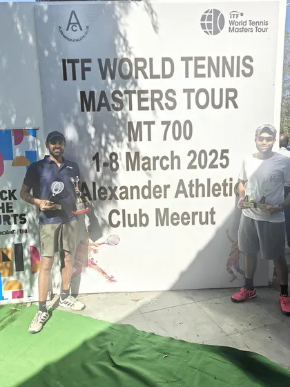 Standing proud with our singles and doubles trophies after a demanding tournament week.