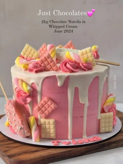 A fun and colourful drip cake loaded with pink and white chocolates and marshmallows. This is a 2kg Chocolate Nutella cake.