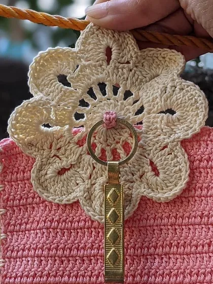 A closer look at the intricate floral lace detail on one of our custom phone pouches. We love adding these special touches to our creations.