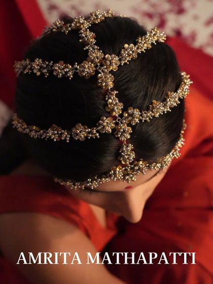 An Amrita mathapatti offers a modern take on a traditional headpiece. Its delicate design is perfect for pre-wedding festivities.