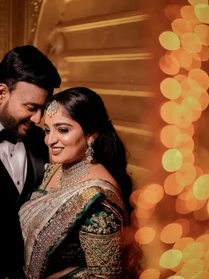 A quiet moment for the couple amidst the grand reception. We love using creative lighting like this beautiful bokeh effect to create romantic, artistic portraits that feel both intimate and grand.