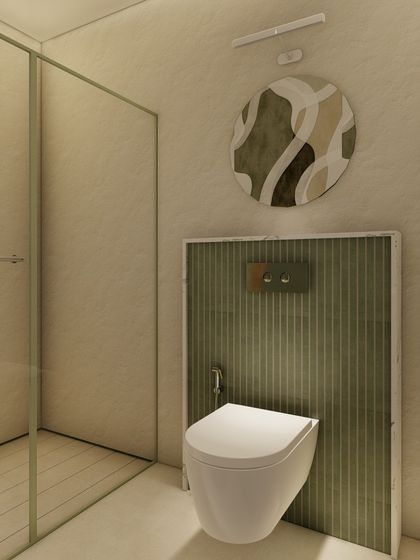 A minimalist toilet area featuring a wall-mounted commode against a fluted green accent panel. The design is clean and simple, with a small piece of abstract art adding a touch of personality.