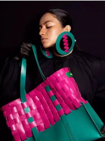 Another angle from the Chamar Studio shoot, highlighting the contrast between the vibrant accessories and the clean, polished makeup. This look demonstrates how makeup can support a brand's bold aesthetic.