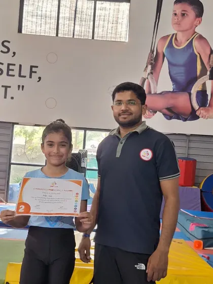 This gymnast has earned her Level 2 certificate, a great achievement in her training.
