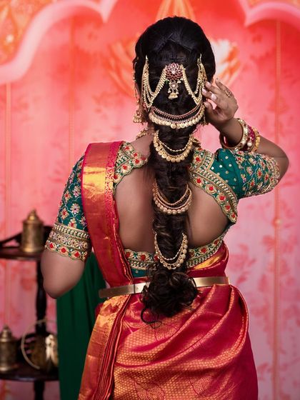 A view of the intricate bridal hairstyle from the back. Even with a focus on makeup, I ensure the hair is equally stunning to create a complete, cohesive bridal look.
