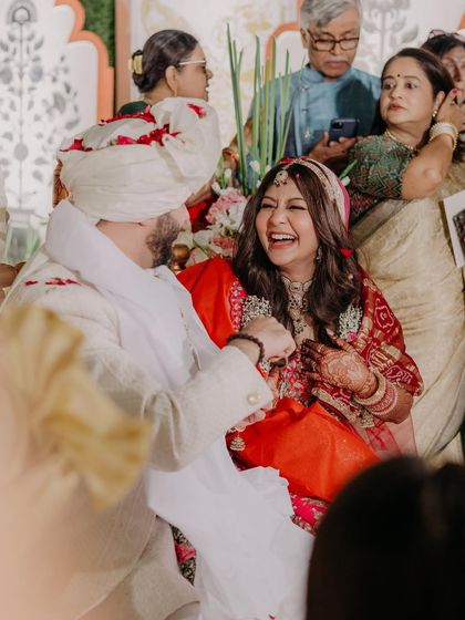 Pure, unadulterated laughter. Her makeup is designed to look beautiful even in the most candid and joyful moments of the wedding day.