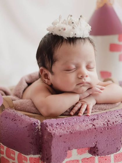 A close-up of our little princess, sleeping peacefully in her castle. The tiny crown is the perfect finishing touch.