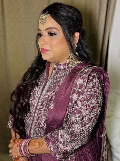 A side profile, showing the hairstyle.