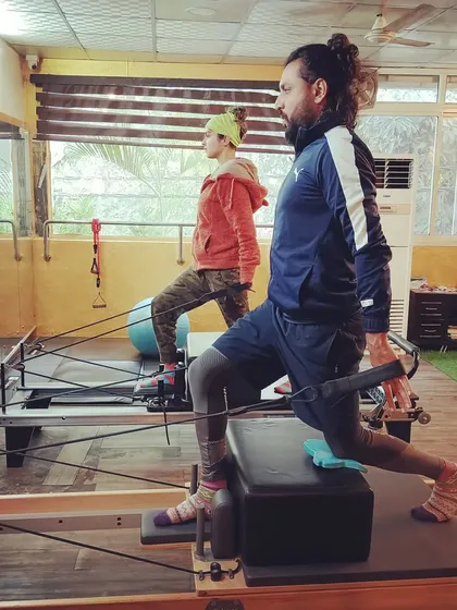 Rise and shine, it's Pilates time. A snapshot of clients performing lunges on the reformer, a great exercise for leg strength and hip flexibility.