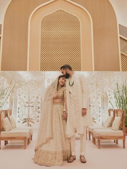 A wide shot of the couple after the ceremony. The decor is as elegant and understated as her bridal look.