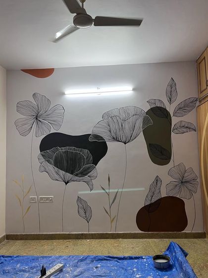 The completed boho floral mural. The mix of earthy tones and delicate gold accents gives it a warm and modern feel.