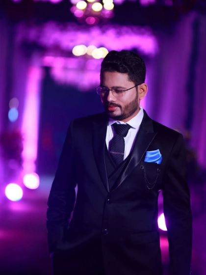 A thoughtful pose. The groom's makeup is subtle, ensuring he looks his best without looking overdone, even in moody lighting.